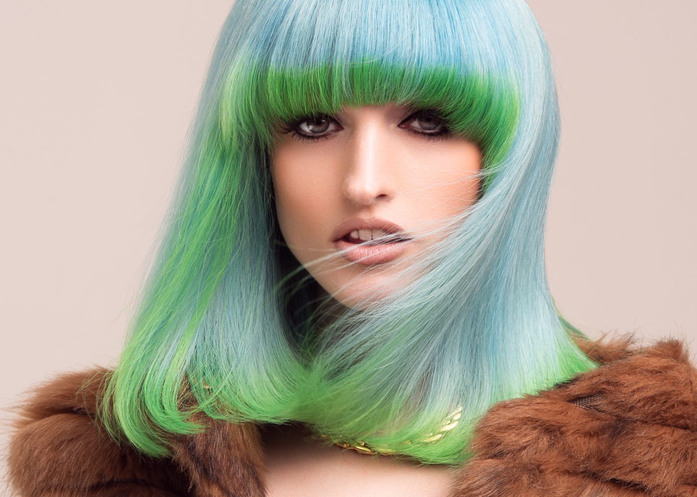 Blue and green colour-blocked bob with heavy fringe